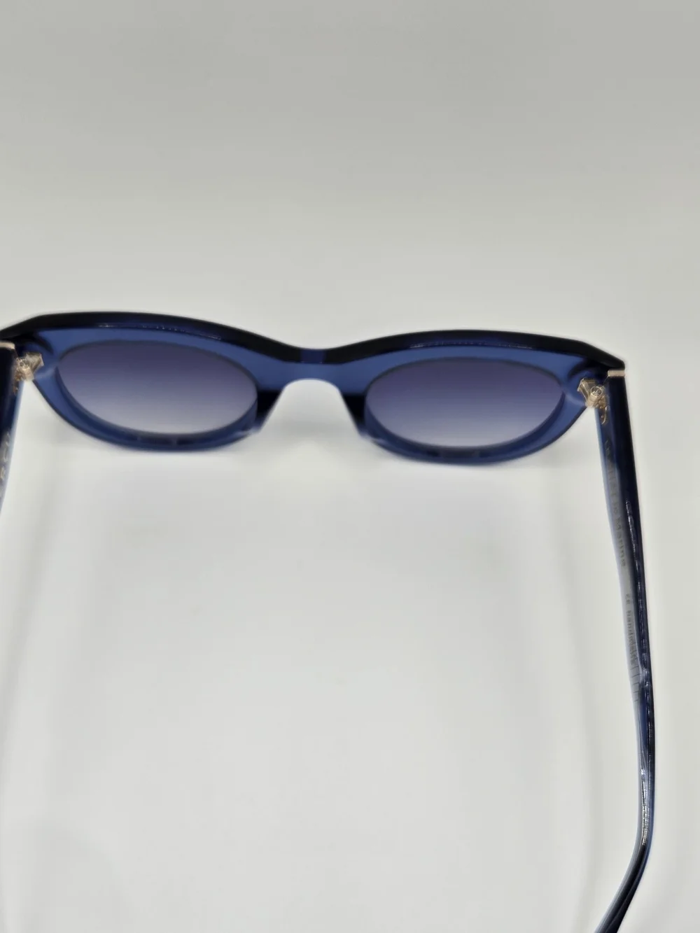 Aperçu sunglasses featuring a bold acetate frame and gold tone branding
